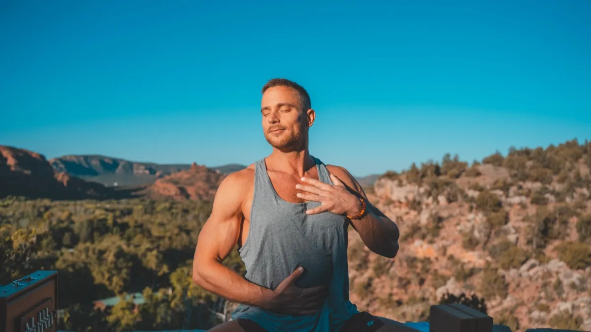 Jack Rosenkrantz with hand on heart, eyes closed in Sedona